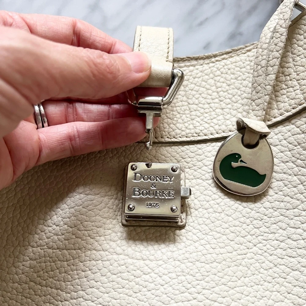 Dooney & Bourke Pebbled Leather Cream Shoulder Bag Duck Medallion Ivory